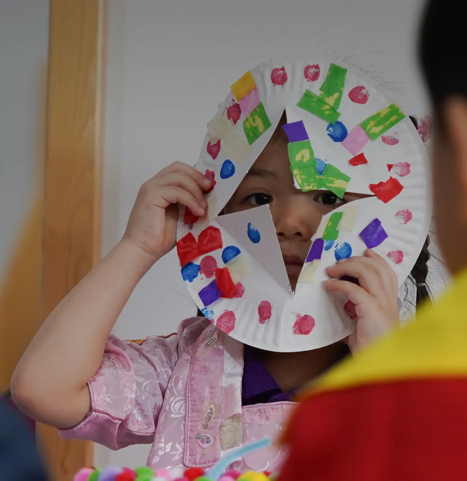 Happy child wearing mask during Sky Preschool activities